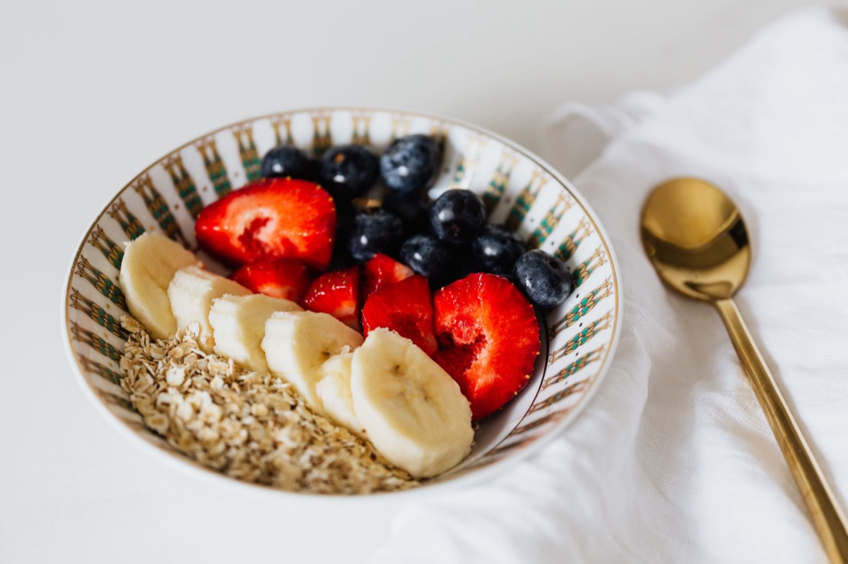 A healthy breakfast bowl with oats and berries for child nutrition.