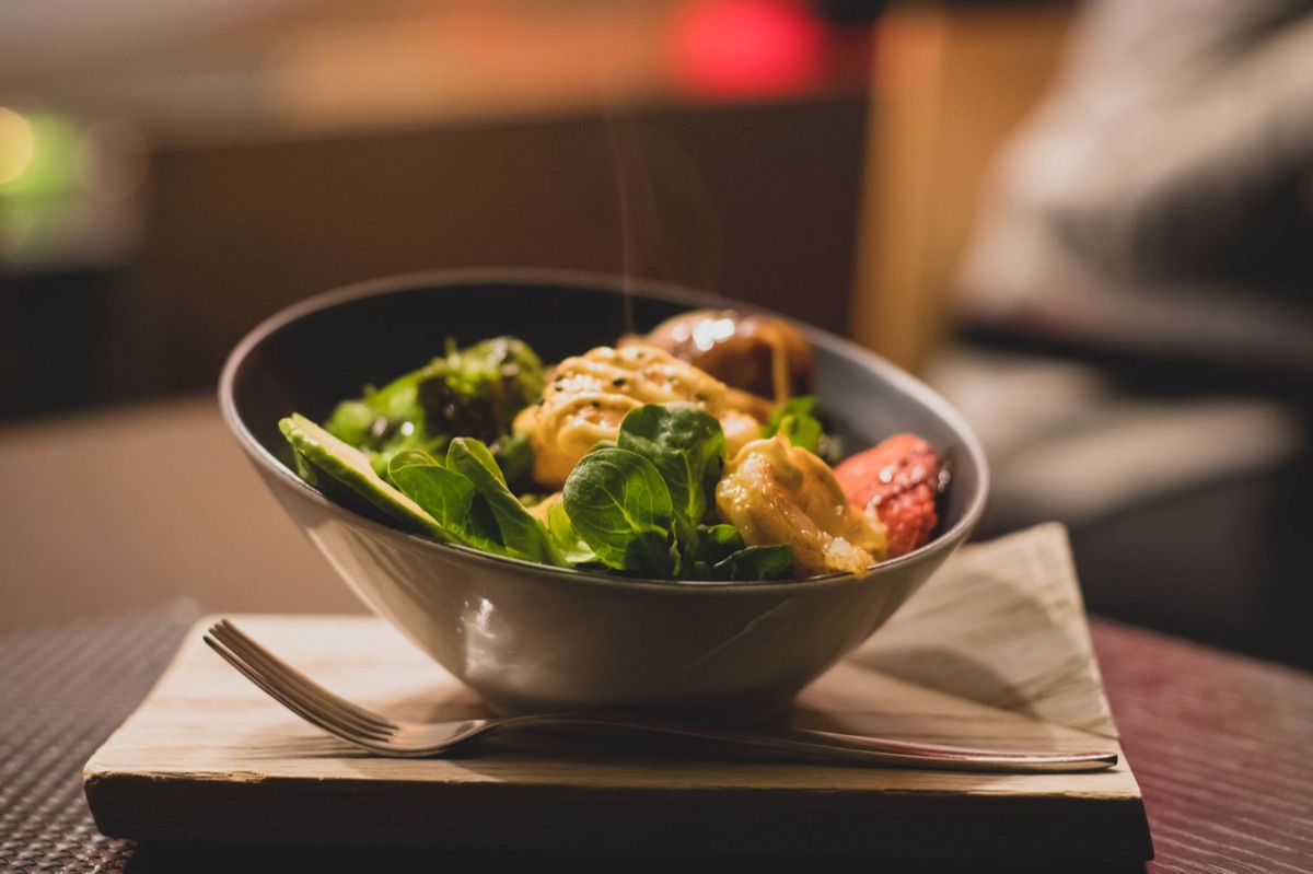 Healthy salad bowl with mixed greens and grilled chicken