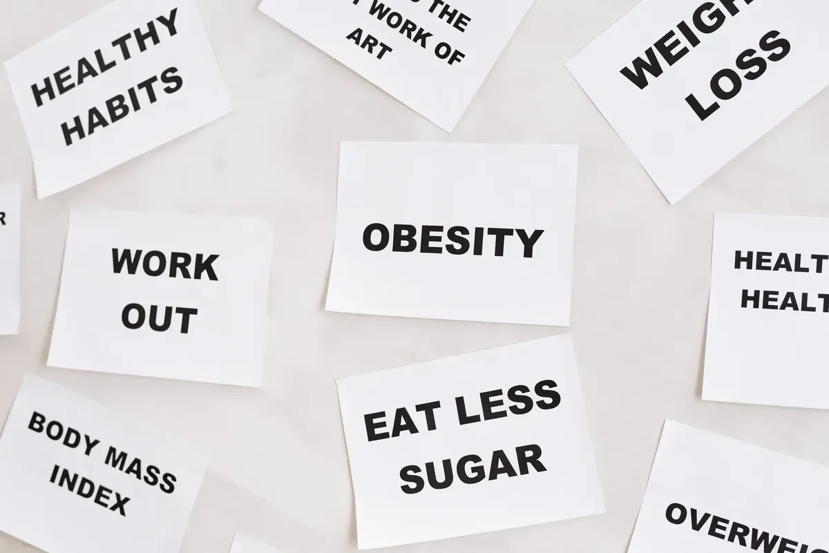 Conceptual image featuring motivational cards on health, fitness, and wellness on a white background.